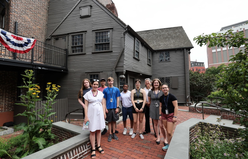Professor Katy Lasdow and Dean Edie Sparks stand with high school history students on their tour of Boston's North End