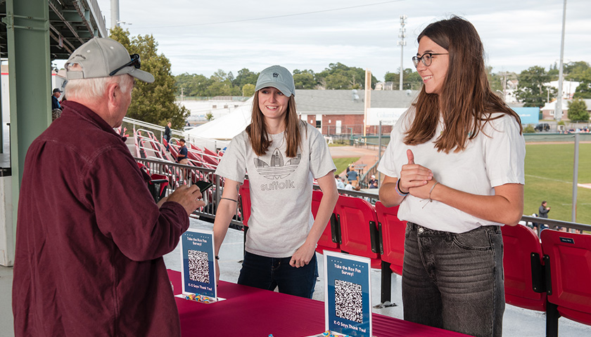 Chaurice Chaput and Sammi Todaro chat with a Brockton Rox fan