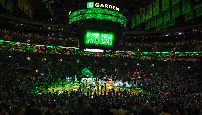 Image of center court at the TD Garden pre-game, with the "Make Some Noise" sign featured