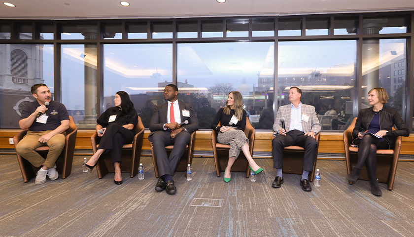 Image of panelists at the "Business With Purpose: Beyond the Balance Sheet" panel