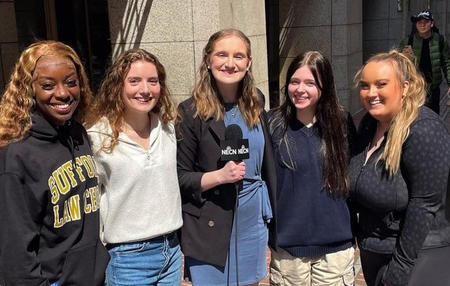 Shannon Stanton, center, poses with fellow Suffolk in the City reporters Claury Carner, Grace Laverriere, Bridget Hynes, and Maura Sullivan after a successful shoot.