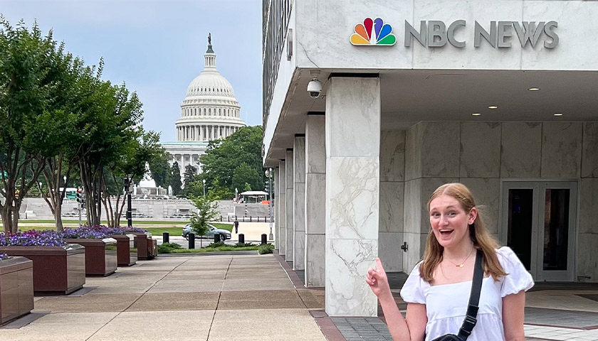 Shannon Stanton standing in front of the NBC News Washington bureau with the US Capitol in the background