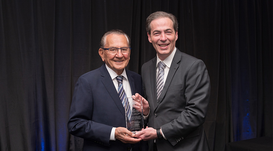 Judge Frank Caprio and Suffolk Law Dean Andy Perlman holding an award