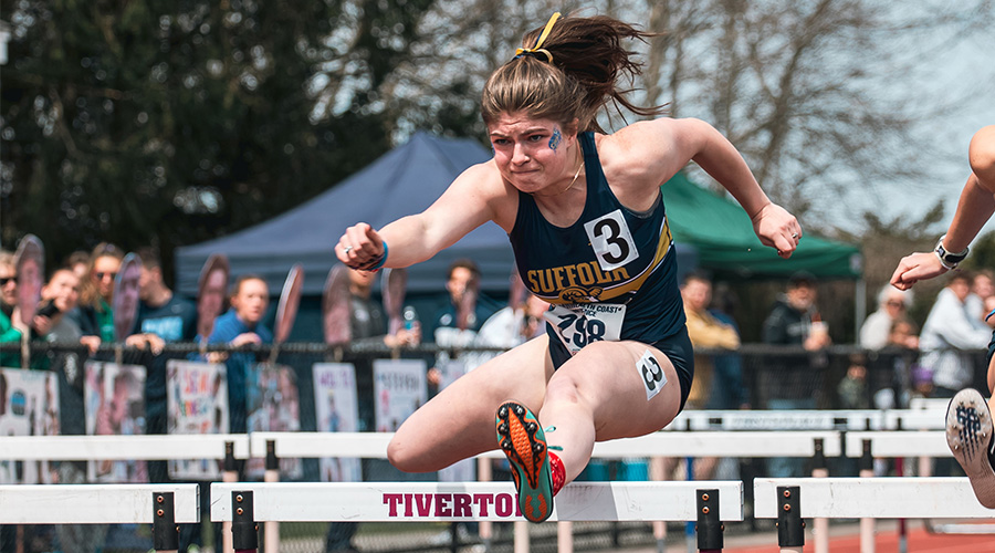 Catherine Madden jumping a hurdle during a race