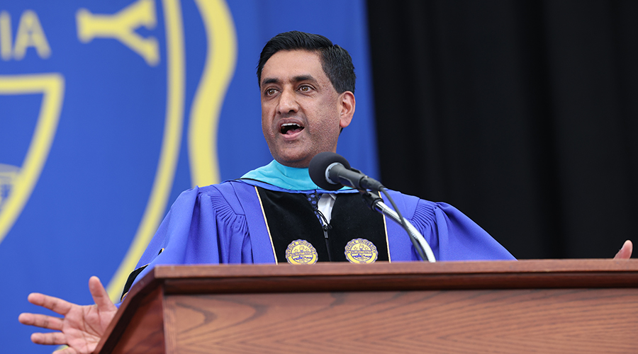 Rep. Ro Khanna addresses the Suffolk University College of Arts & Sciences Class of 2026 from a podium on stage