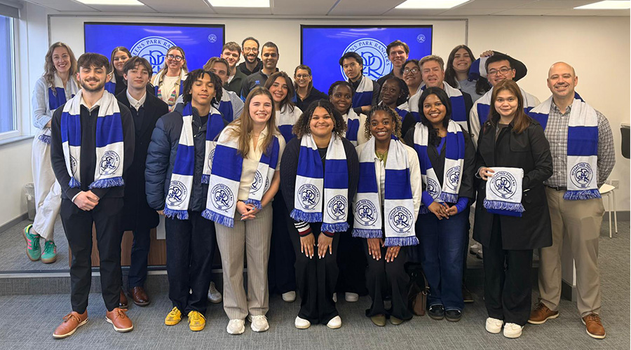 Suffolk students wearing scarves at Queens Park Rangers office in London