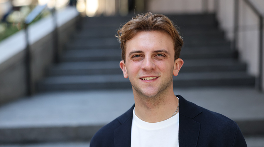 Ryan Chamberlain portrait standing on some steps