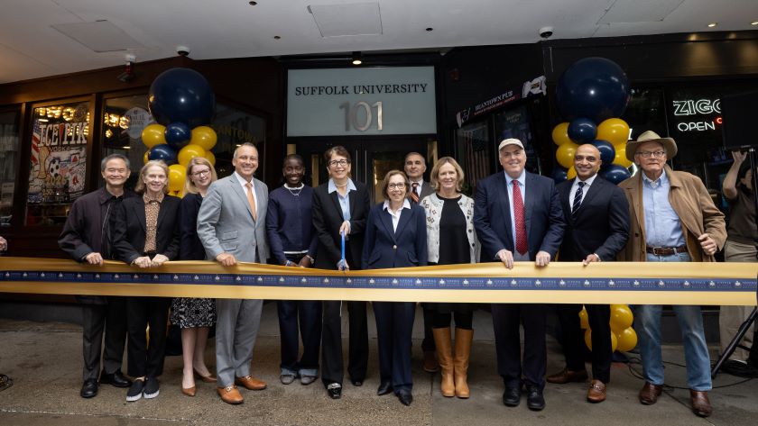 President Kelly and leaders from Suffolk and the city in front of 101 Tremont about to cut a ceremonial ribbon