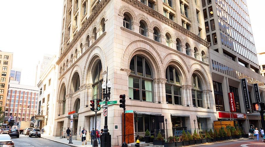 Ames Building facade of stone with arched windows