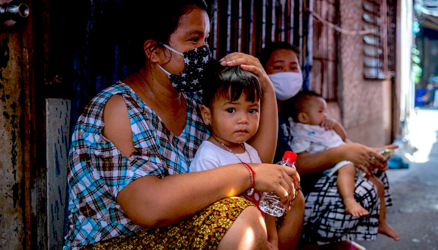 Photograph by Lauren DeCicca of Masked Women and Children