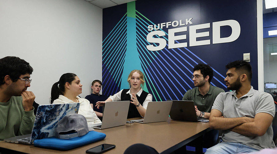 Suffolk students in discussion while in one of the SEED Conference rooms.