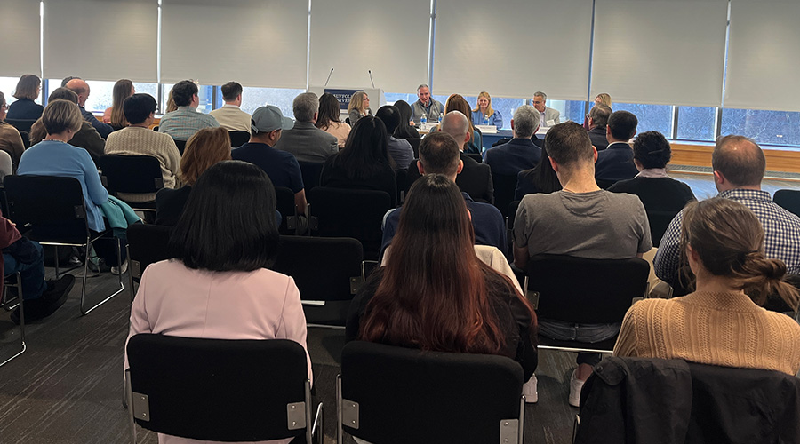 Image of the AI panel and audience