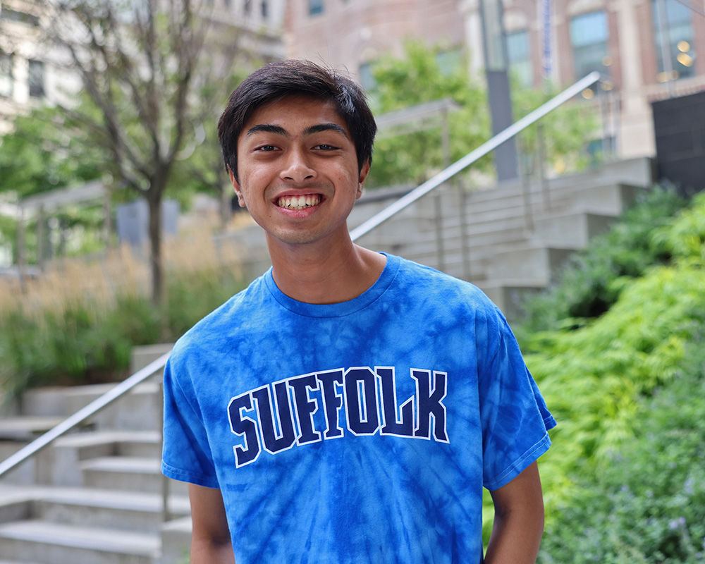 Photo of Ram Supporter standing in Roemer Plaza on campus at Suffolk University.