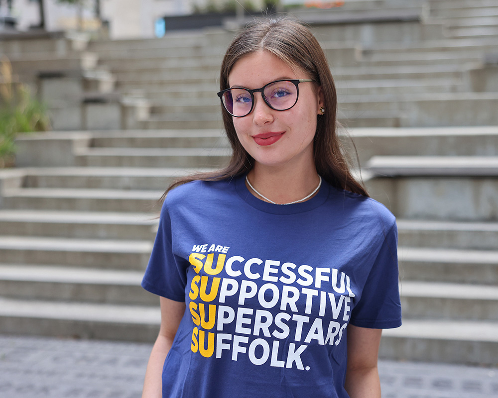 Photo of Ram Supporter standing in Roemer Plaza on campus at Suffolk University.