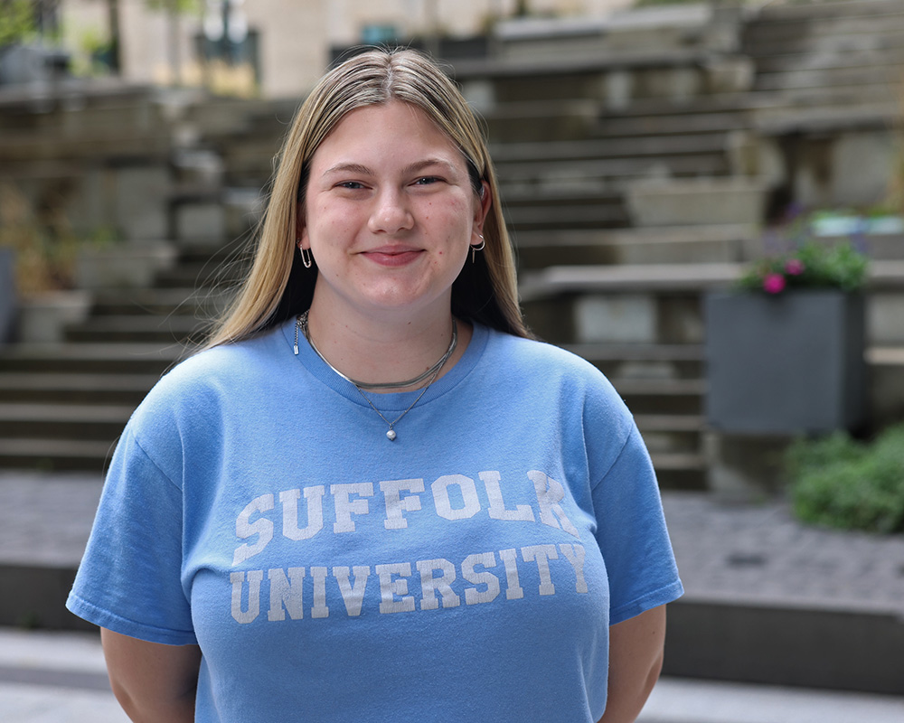 Photo of Ram Supporter standing in Roemer Plaza on campus at Suffolk University.