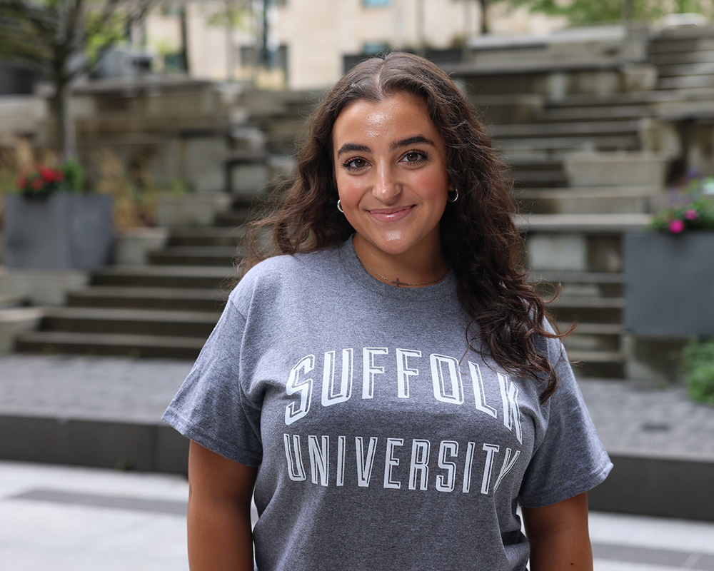 Photo of Ram Supporter standing in Roemer Plaza on campus at Suffolk University.