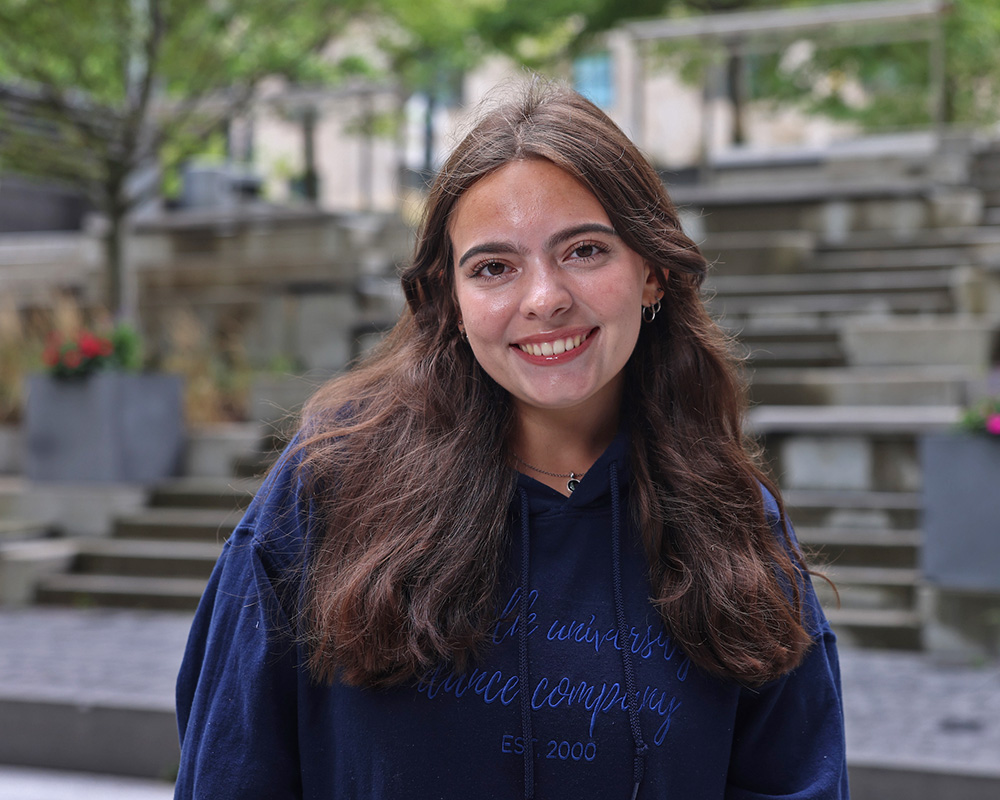 Photo of Ram Supporter standing in Roemer Plaza on campus at Suffolk University.