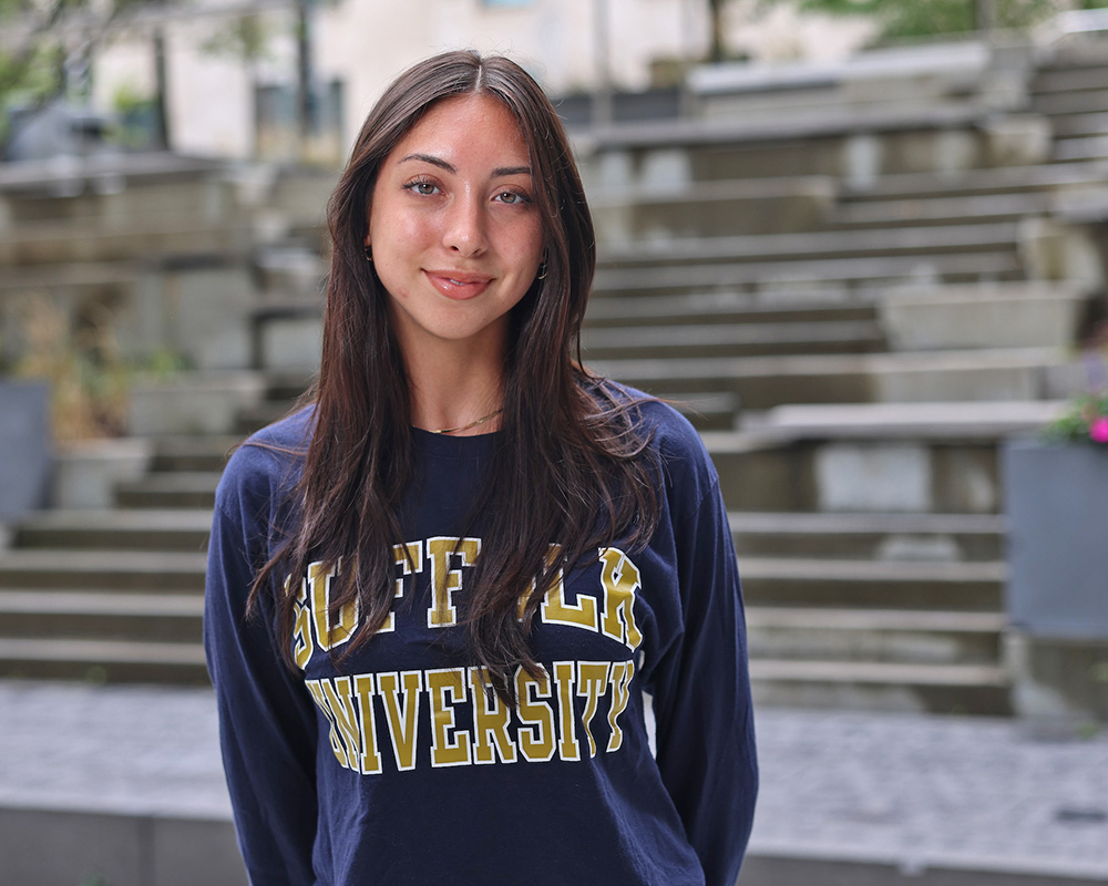 Photo of Ram Supporter standing in Roemer Plaza on campus at Suffolk University.