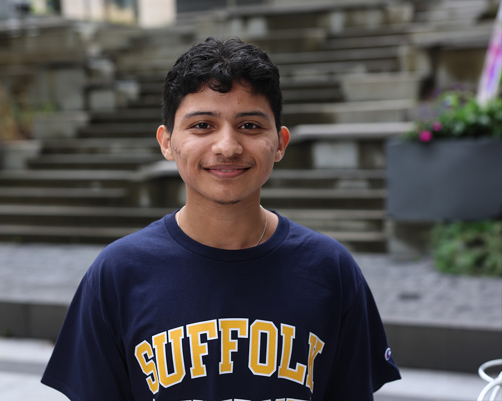 Photo of Ram Supporter standing in Roemer Plaza on campus at Suffolk University.