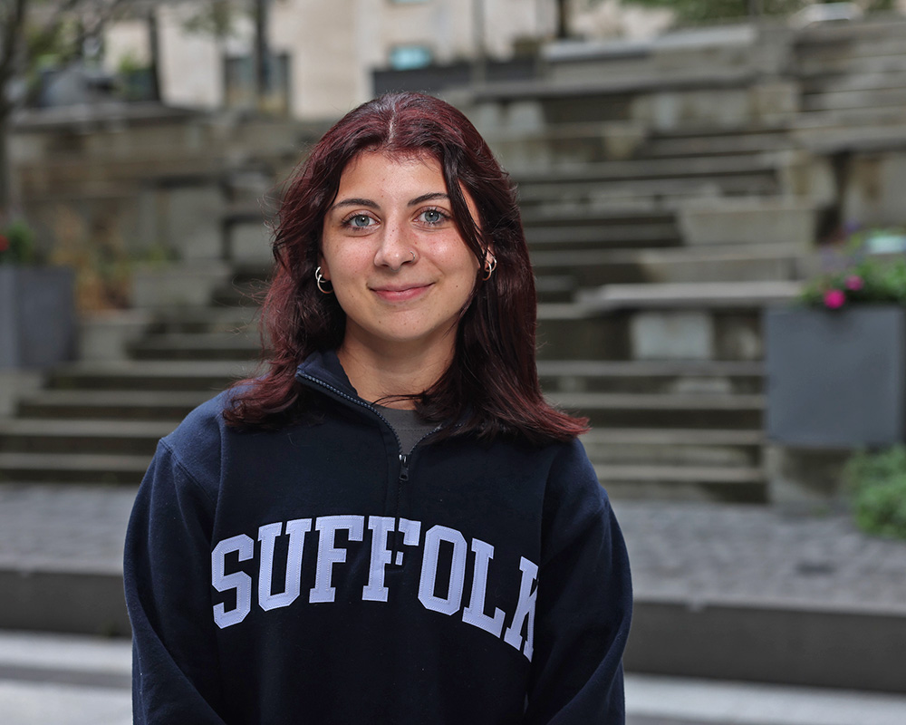 Photo of Ram Supporter standing in Roemer Plaza on campus at Suffolk University.