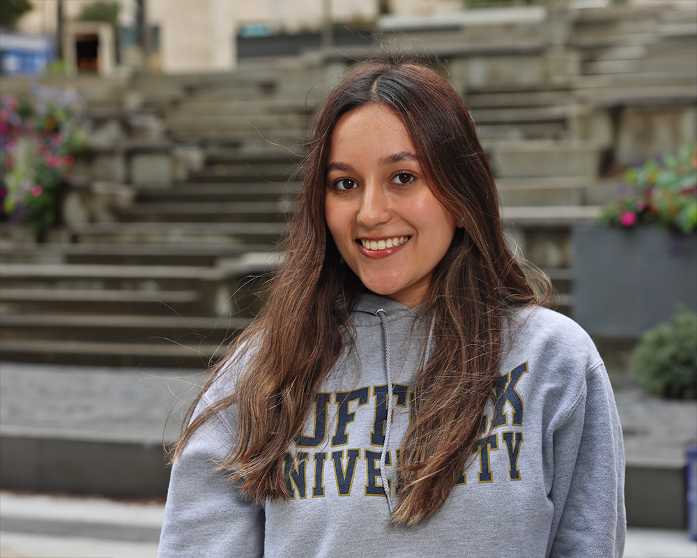Photo of Ram Supporter standing in Roemer Plaza on campus at Suffolk University.
