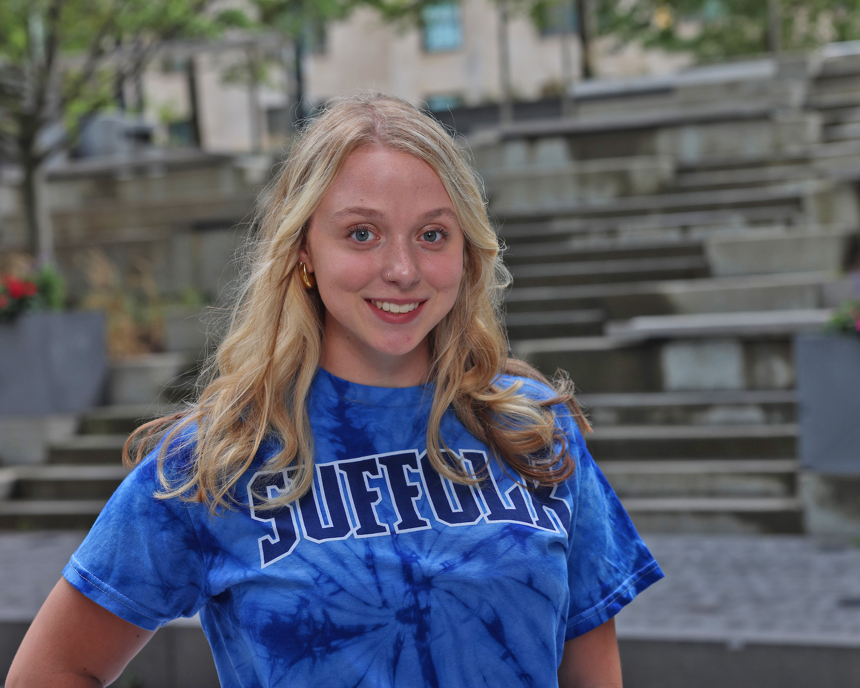 Photo of Ram Supporter standing in Roemer Plaza on campus at Suffolk University.