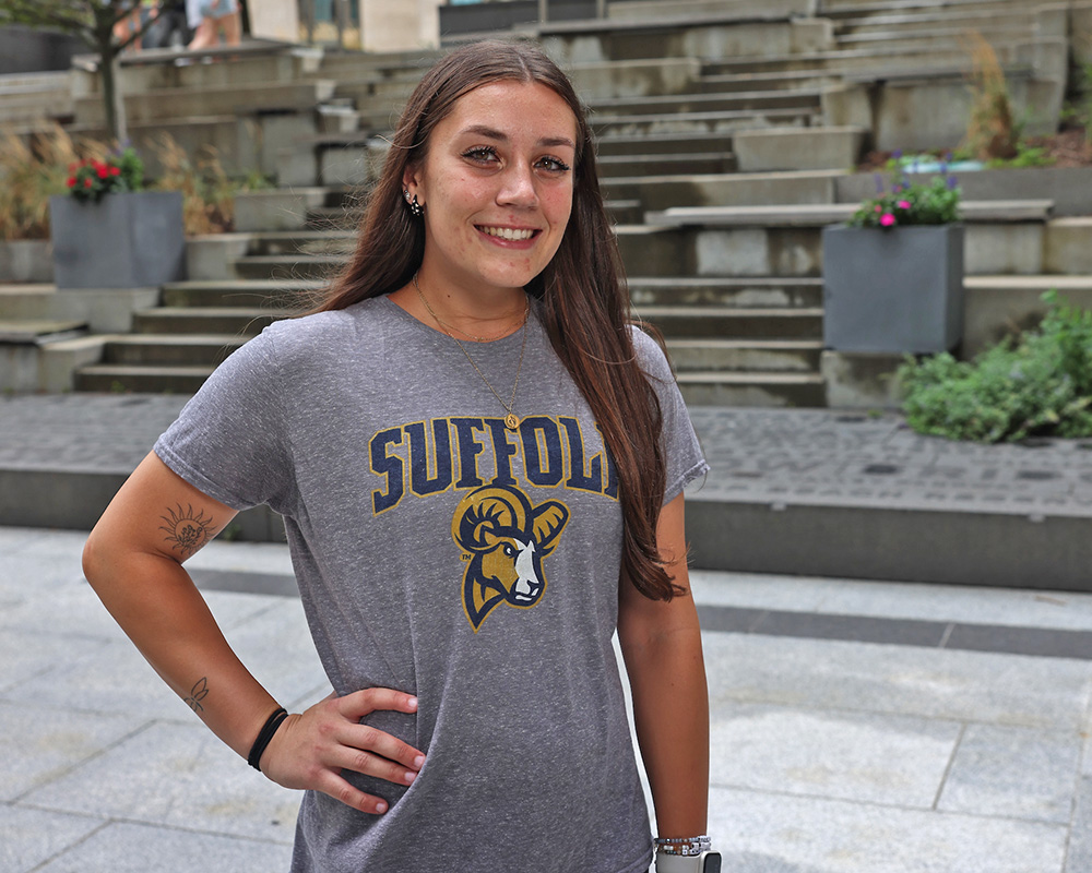 Photo of Ram Supporter standing in Roemer Plaza on campus at Suffolk University.