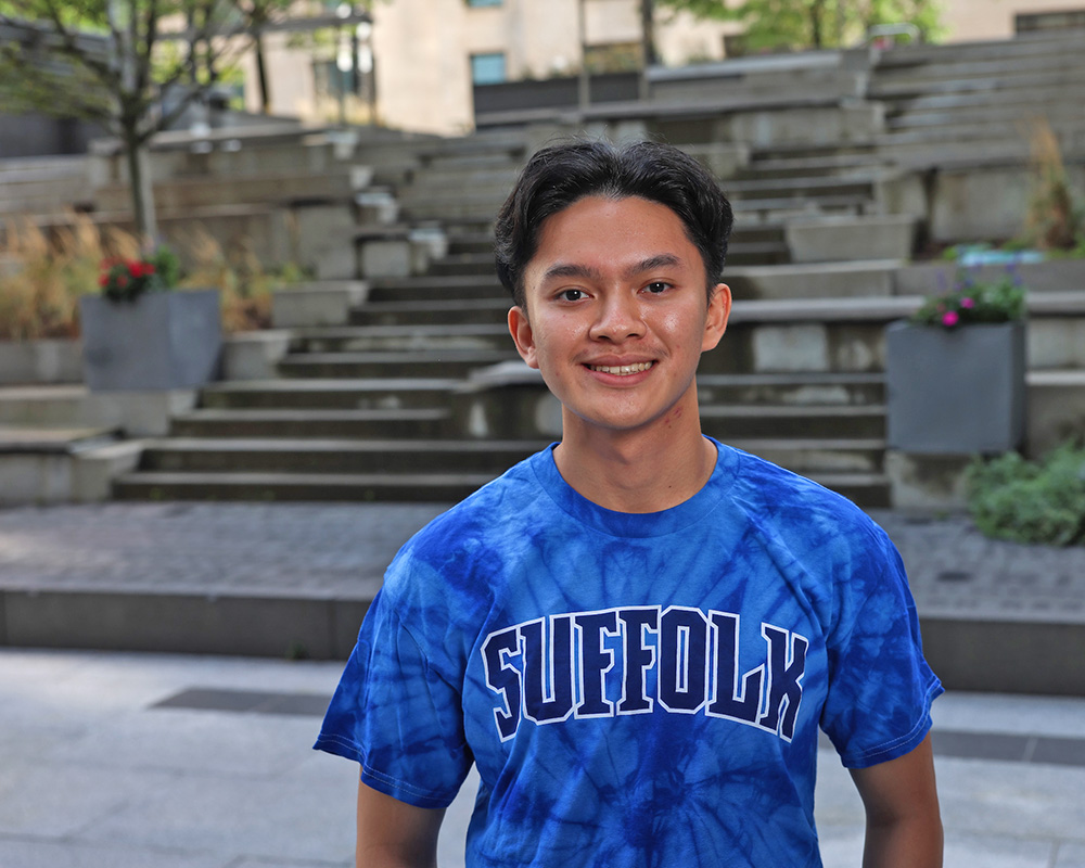Photo of Ram Supporter standing in Roemer Plaza on campus at Suffolk University.
