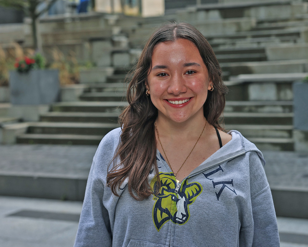 Photo of Ram Supporter standing in Roemer Plaza on campus at Suffolk University.