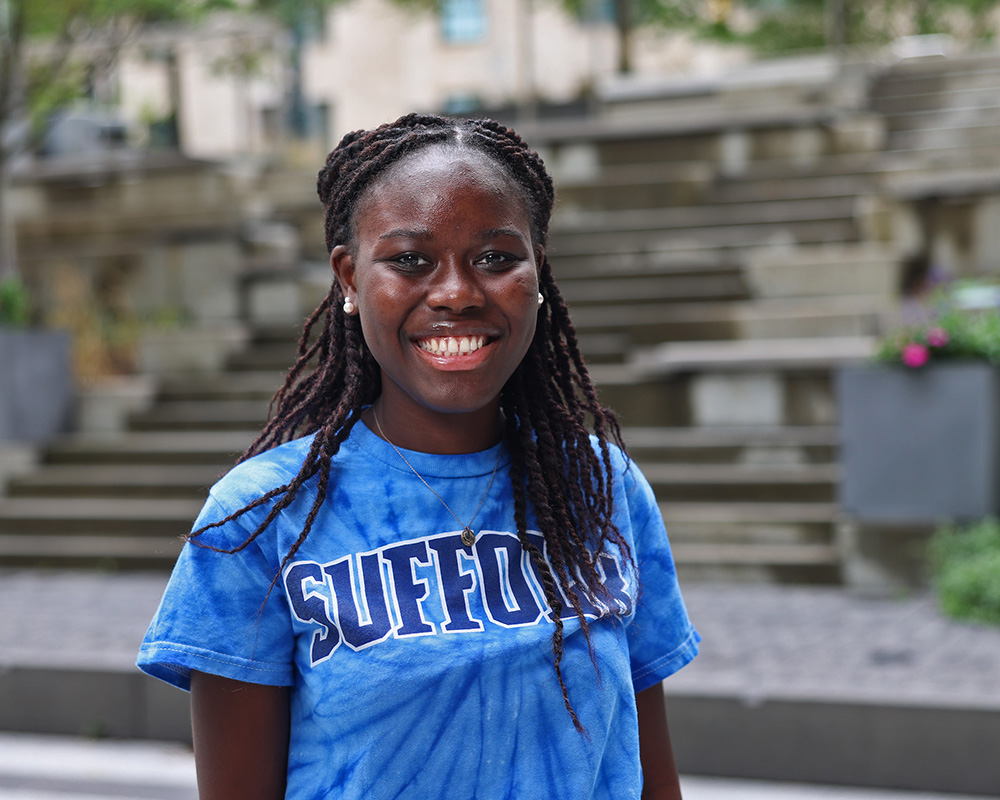 Photo of Ram Supporter standing in Roemer Plaza on campus at Suffolk University.