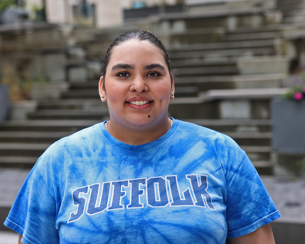 Photo of Ram Supporter standing in Roemer Plaza on campus at Suffolk University.