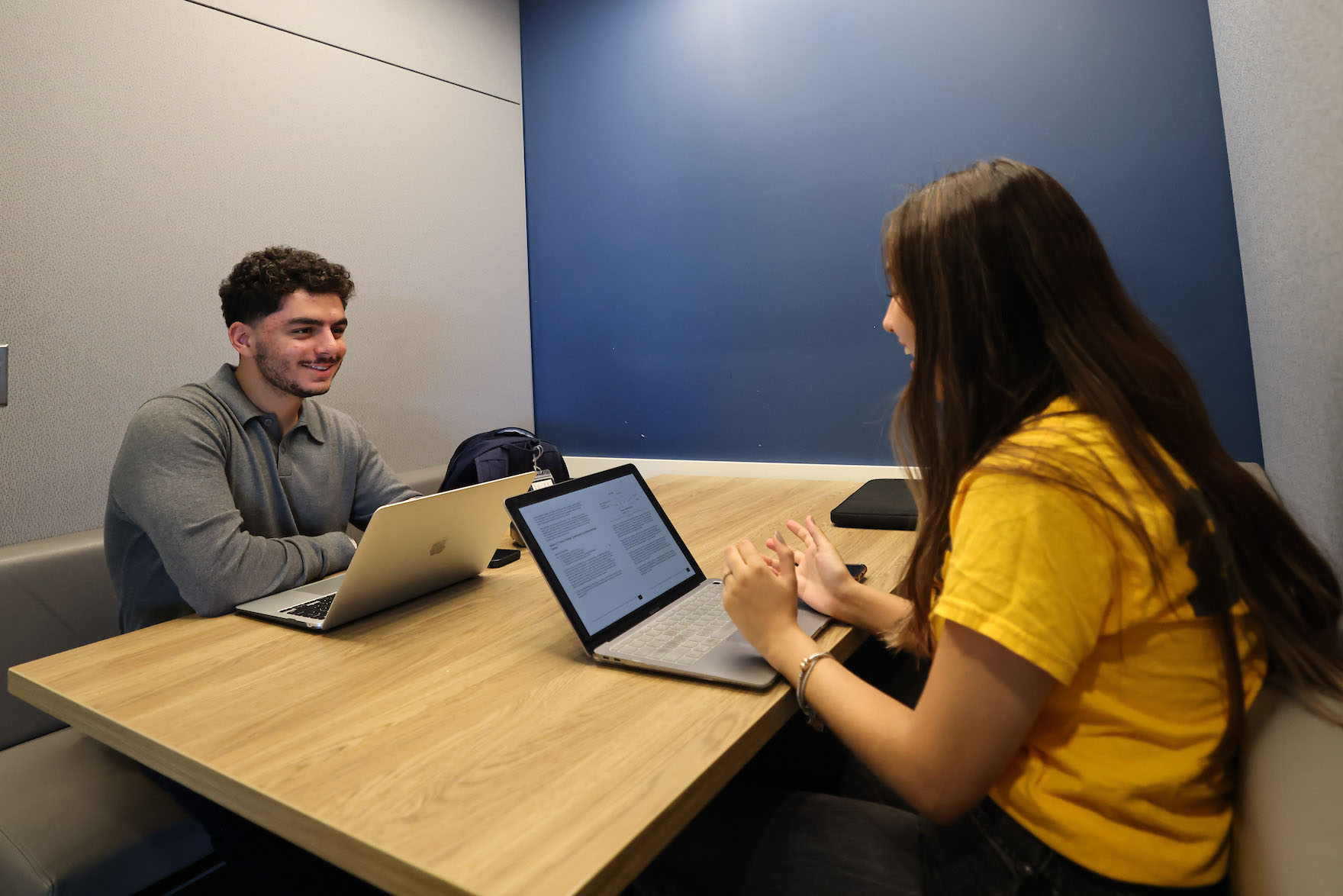 An advisor assists a student.