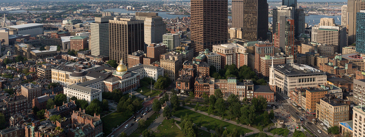 An aerial photo of downtown Boston, including the Boston Common, the State House, the Charles River, and Suffolk University's Campus.