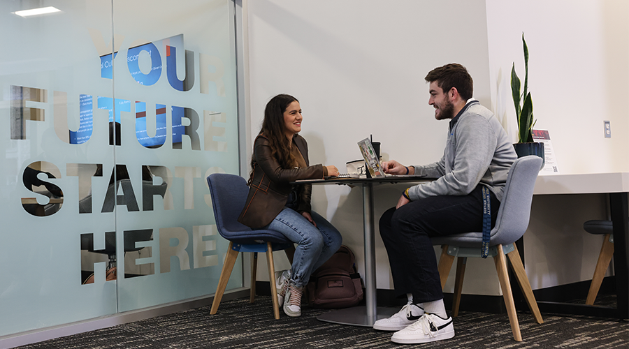 A student speaks with a career counselor in Suffolk's Career Center.